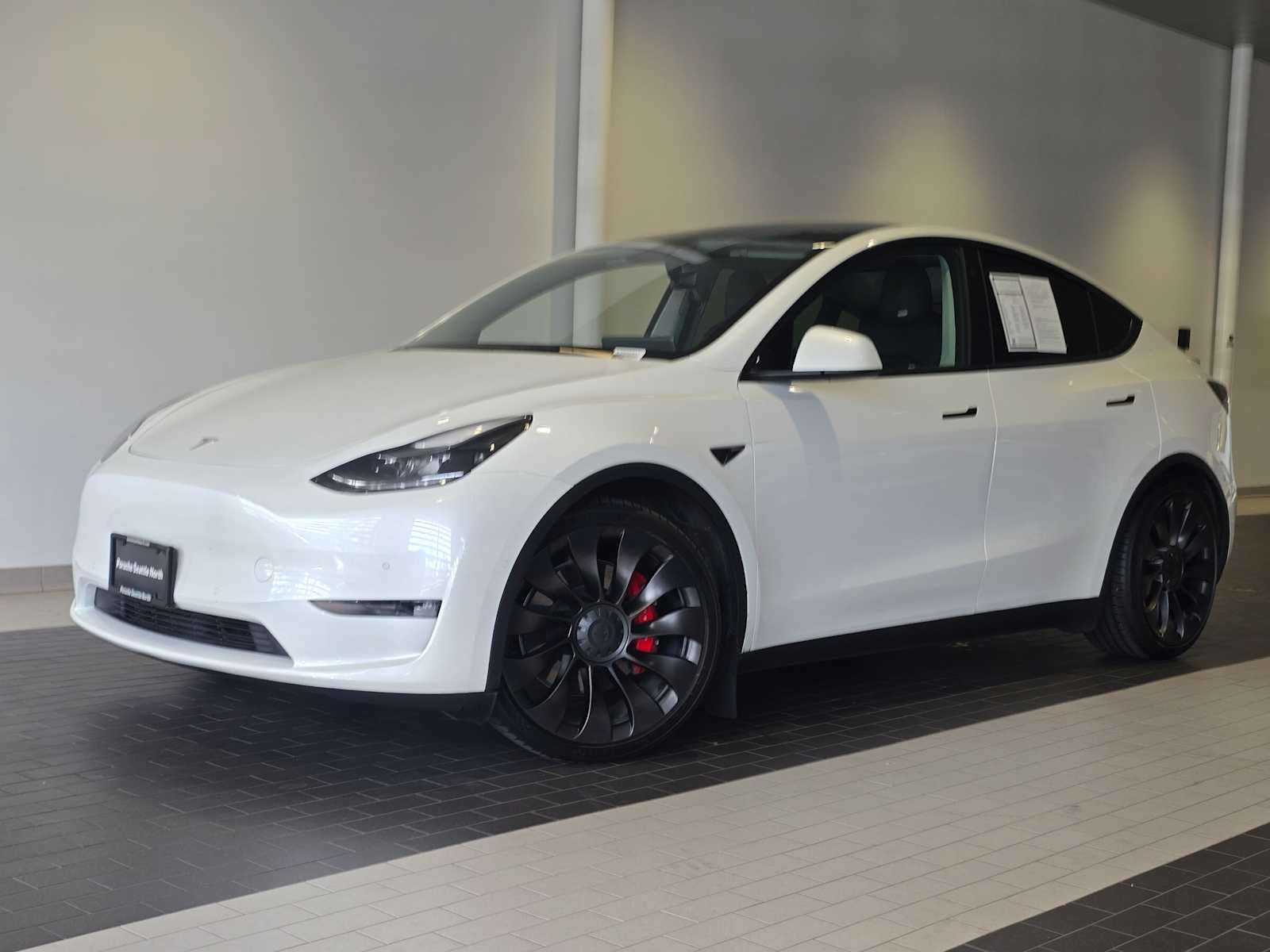 2022 Tesla Model Y Performance in Pearl White Multi-Coat — front three-quarter view