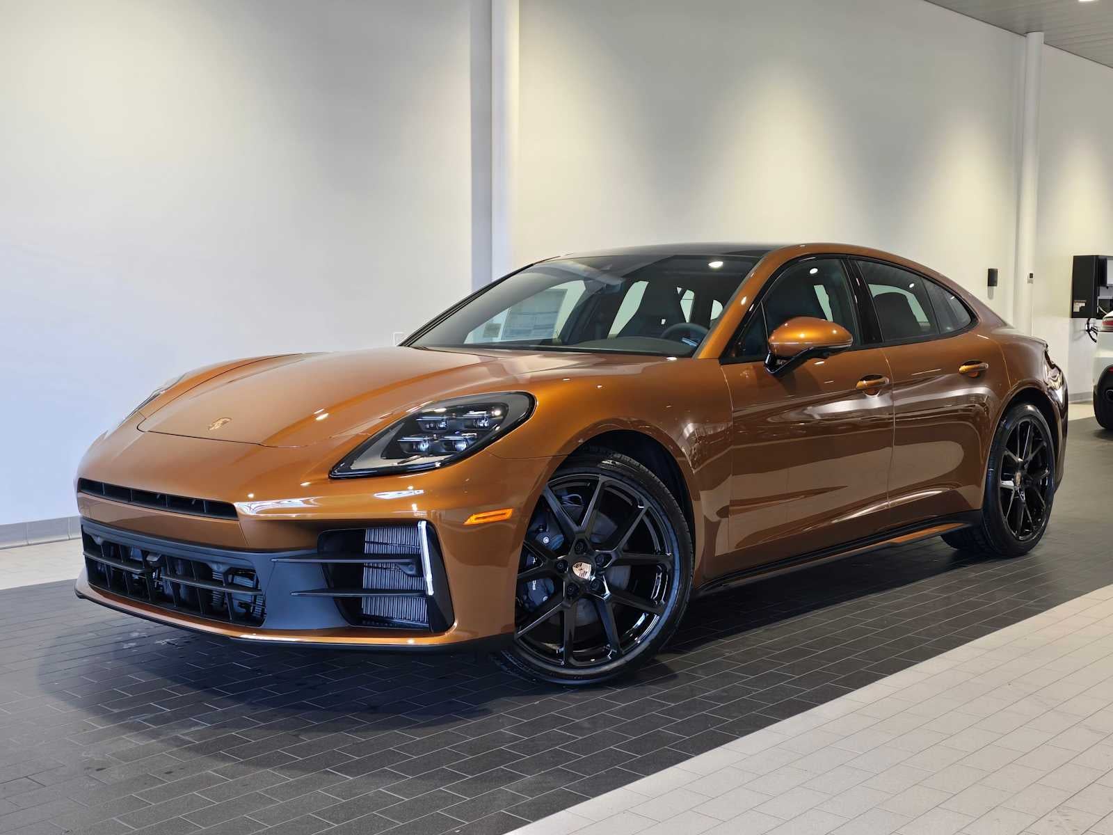 2026 Porsche Panamera Panamera 4 in Madeira Gold Metallic — front three-quarter view