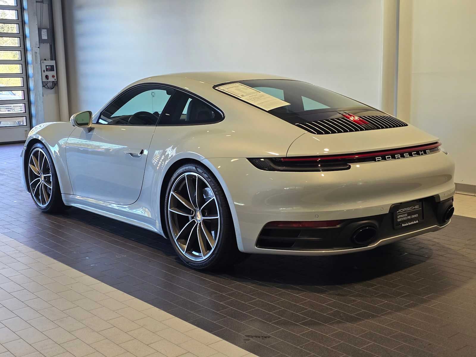 2024 Porsche 911 — rear three-quarter view