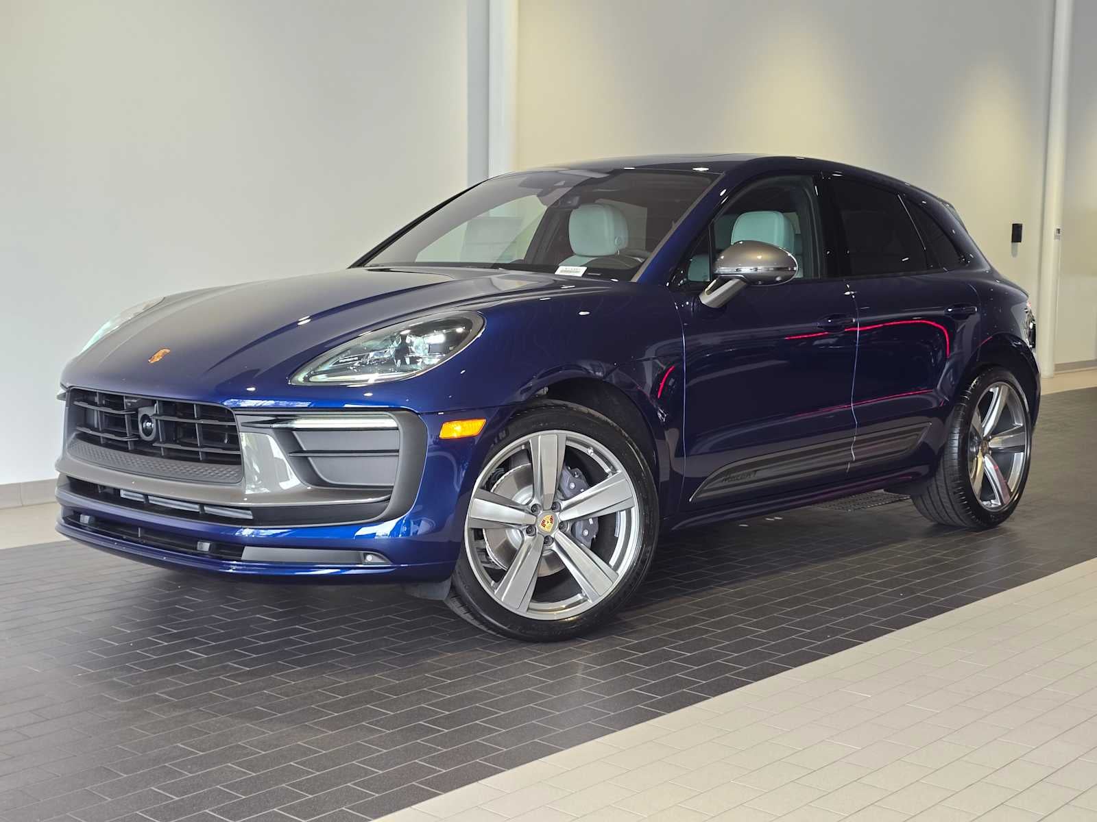 2026 Porsche Macan Macan T in Gentian Blue Metallic — front three-quarter view