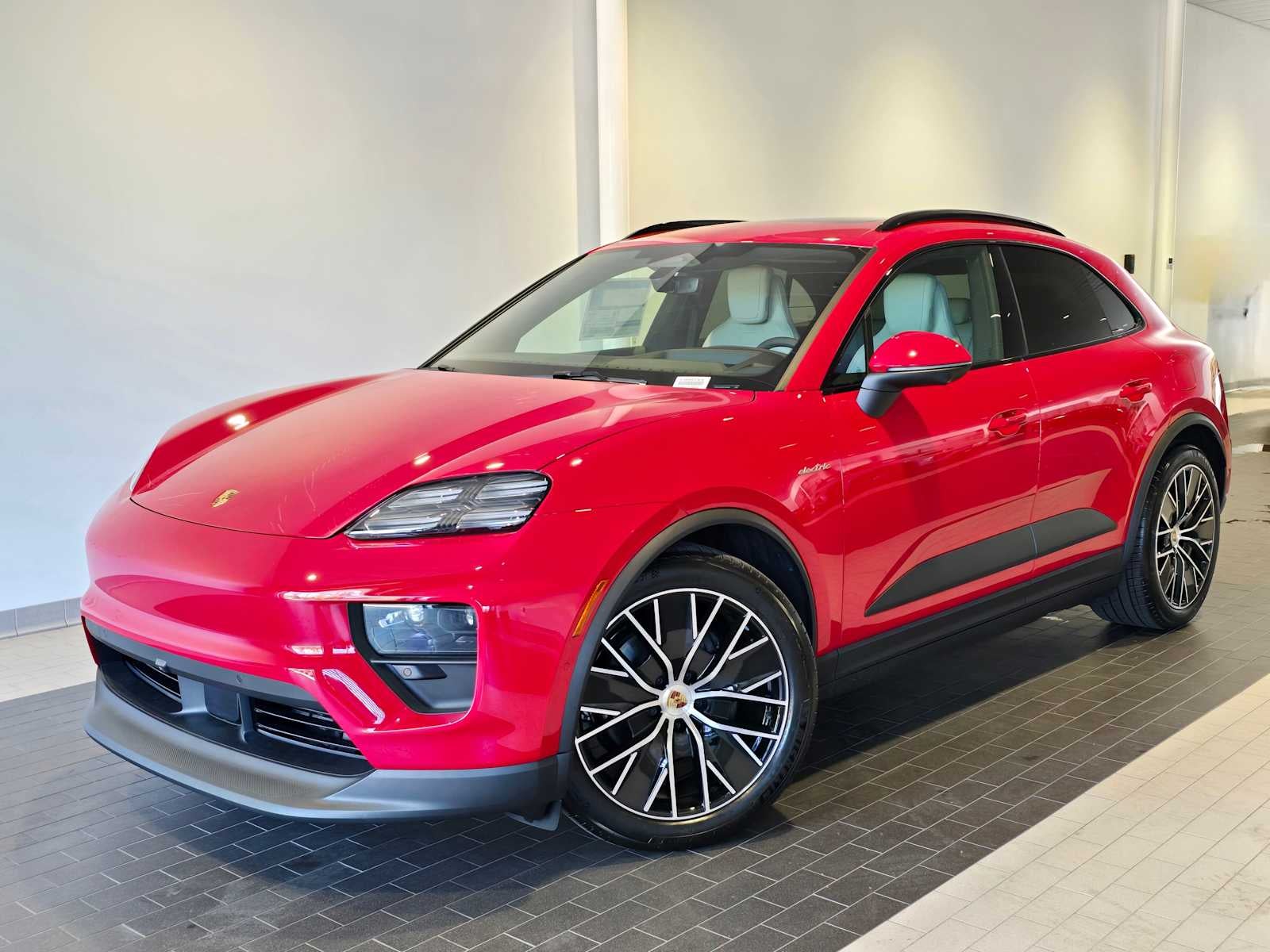 2026 Porsche Macan Macan 4 Electric in Carmine Red — front three-quarter view