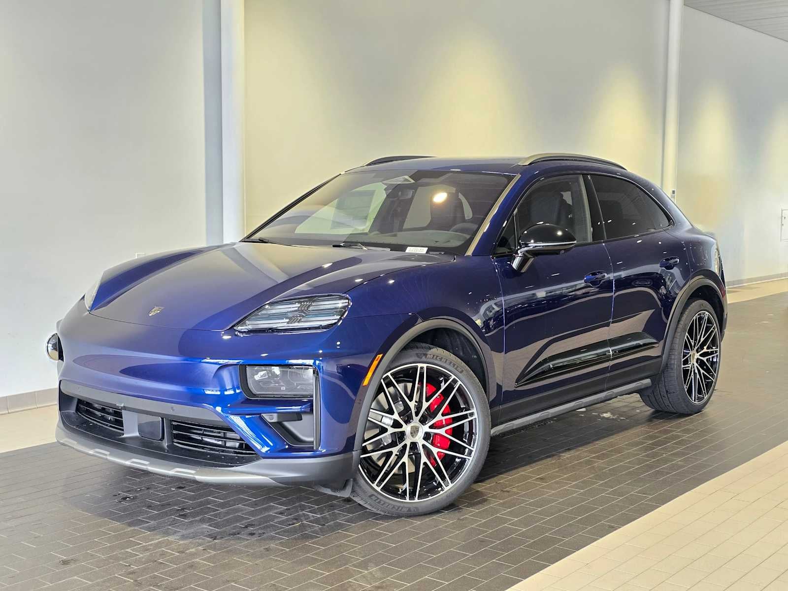 2026 Porsche Macan Macan Turbo Electric in Gentian Blue Metallic — front three-quarter view
