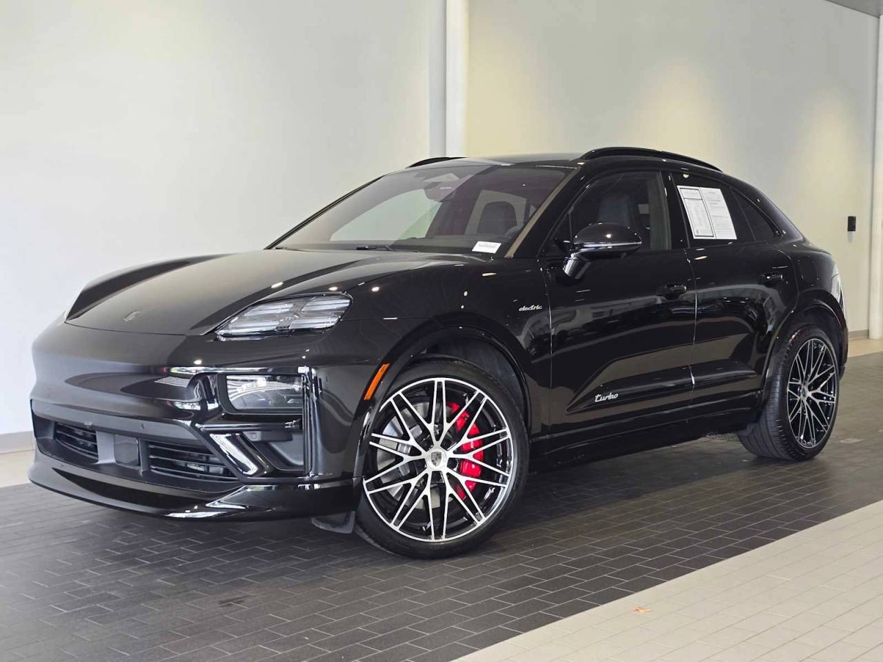 2025 Porsche Macan Macan Turbo Electric in Black — front three-quarter view