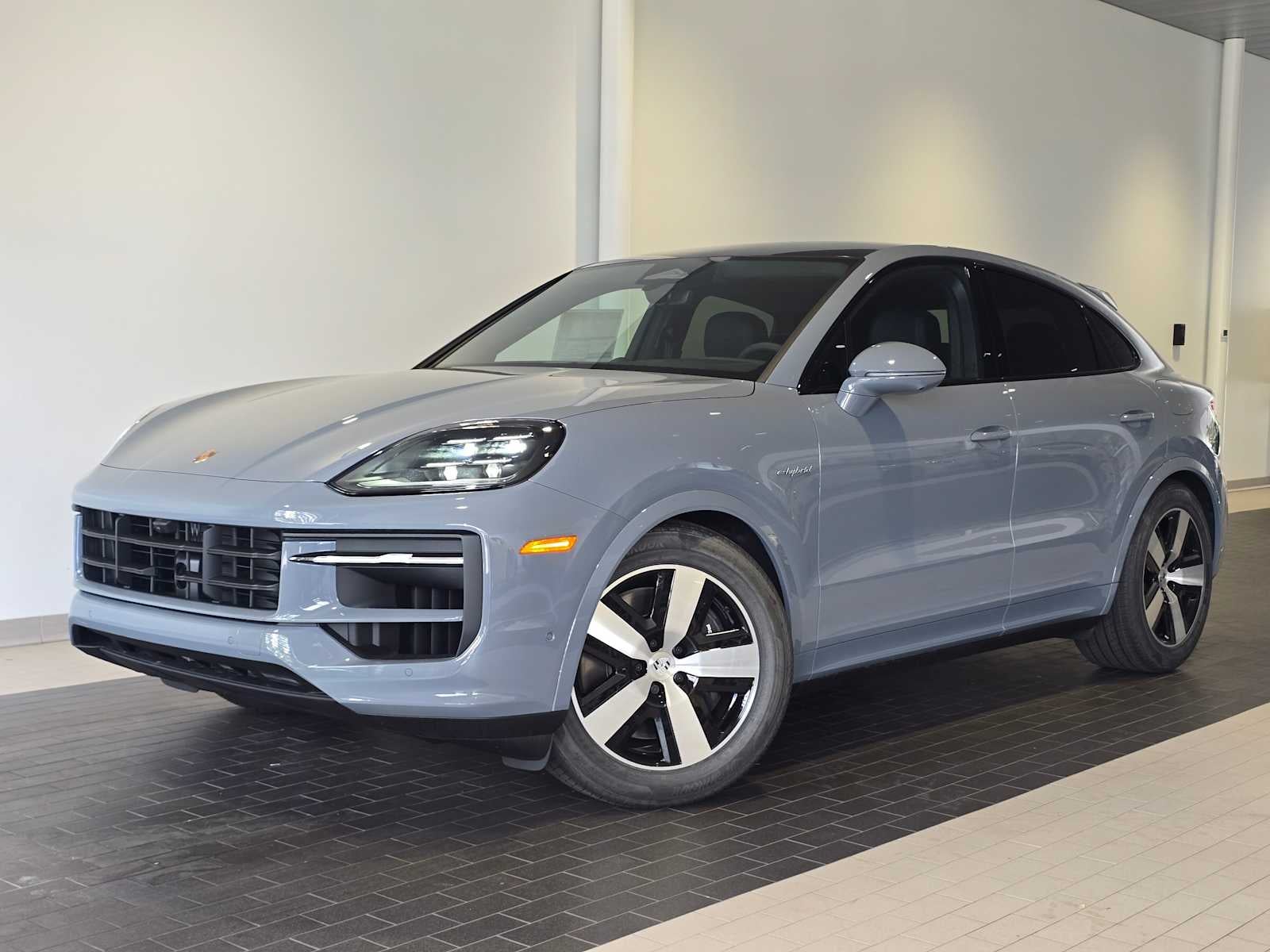 2026 Porsche Cayenne Cayenne E-Hybrid Coupe in Arctic Grey — front three-quarter view