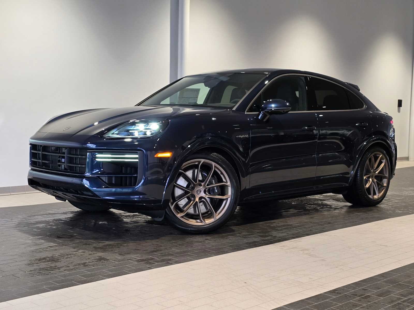 2026 Porsche Cayenne Cayenne Turbo E-Hybrid Coupe in Algarve Blue Metallic — front three-quarter view
