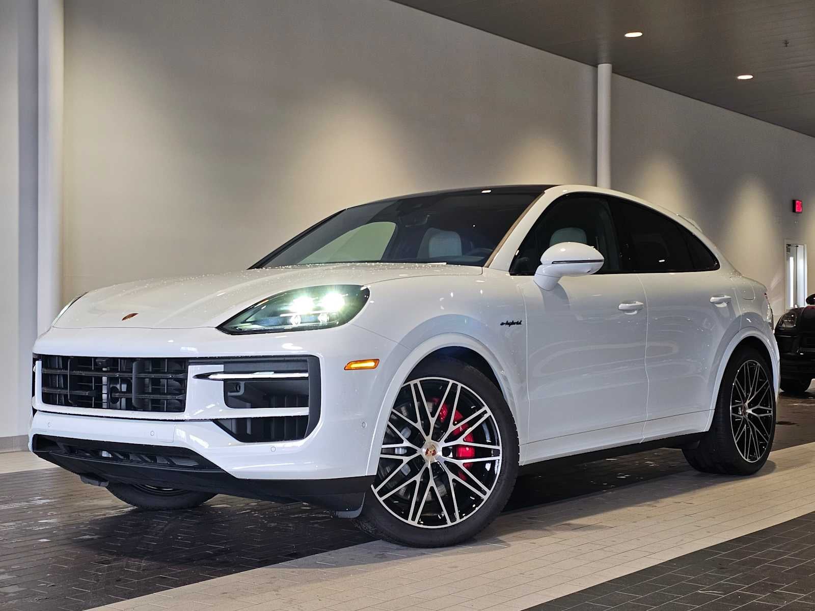 2025 Porsche Cayenne Cayenne S E-Hybrid Coupe in Carrara White Metallic — front three-quarter view