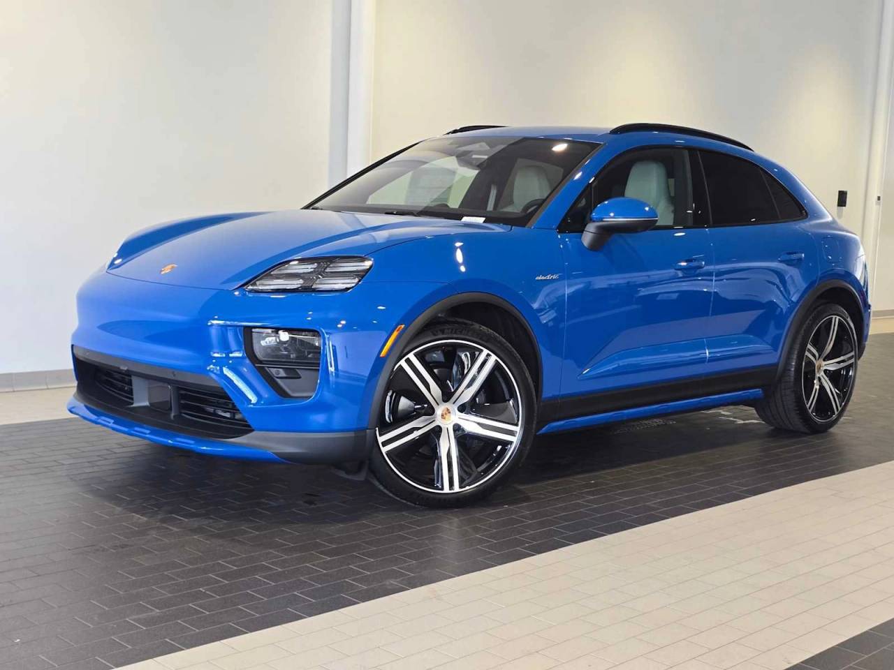 2026 Porsche Macan Macan 4 Electric in Lugano Blue — front three-quarter view